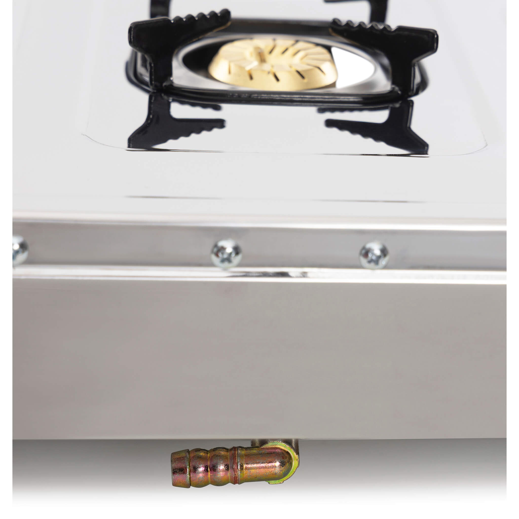 Close-up of a gas stove with a small burner, showing a connection outlet to a hose.