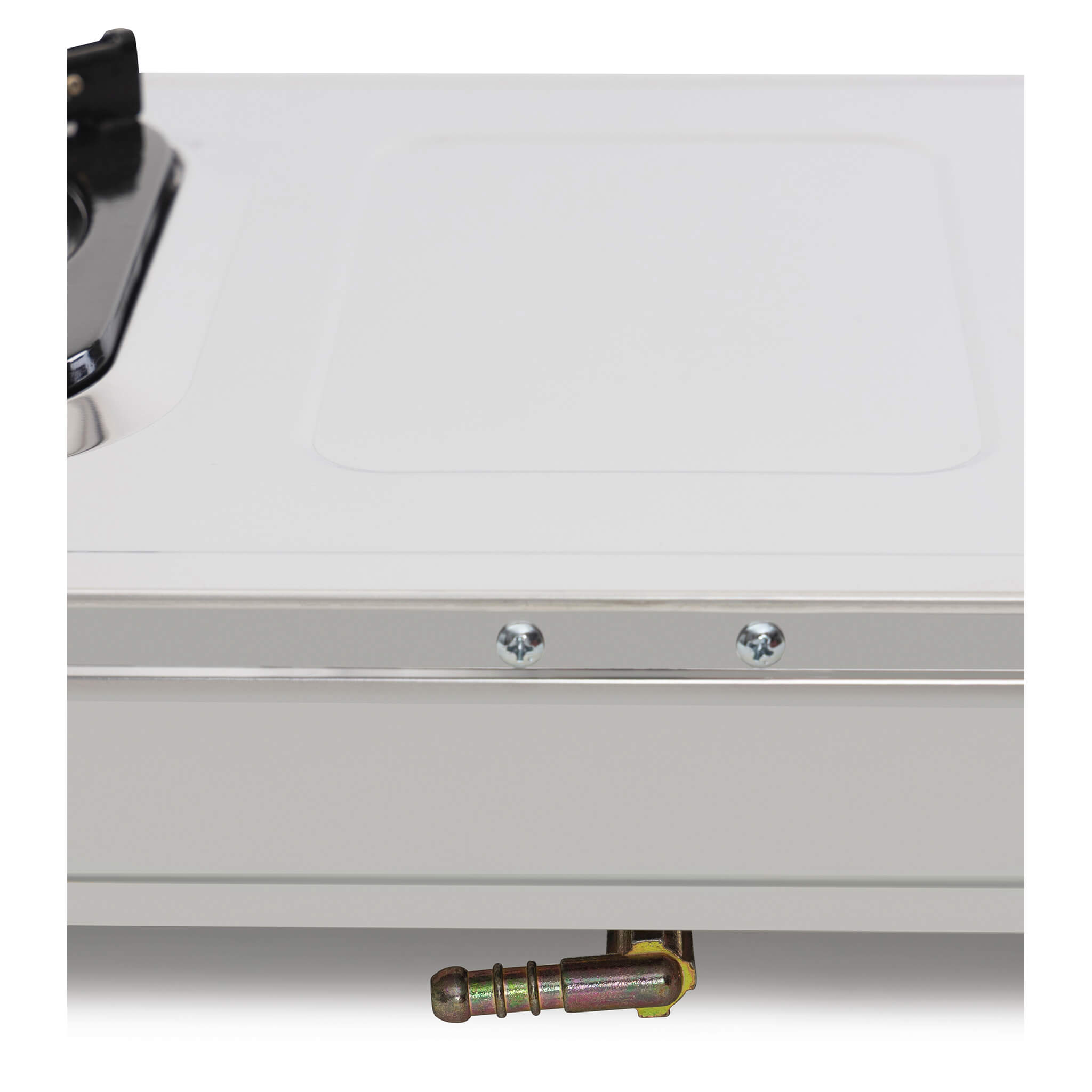 Close-up of a metallic surface gas cooker and its gas outlet