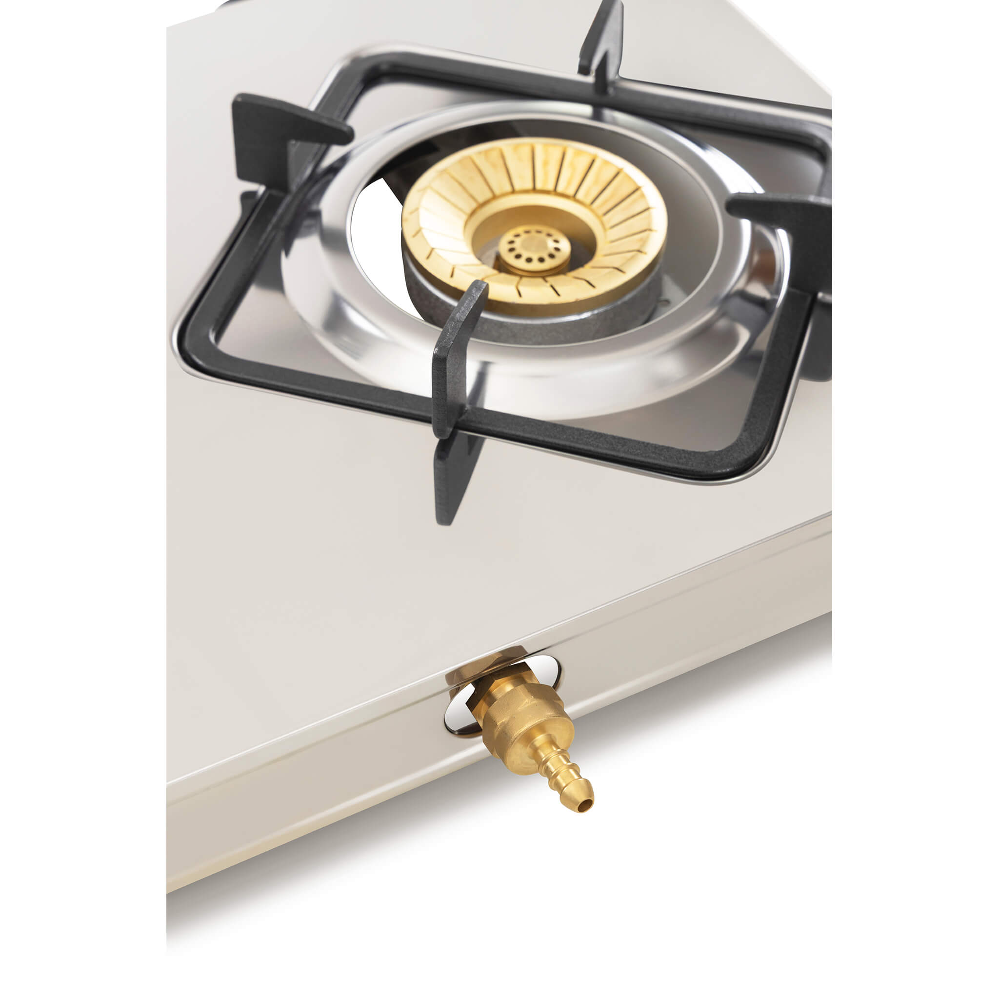 Close-up of a gas stove with a visible burner and gas outlet
