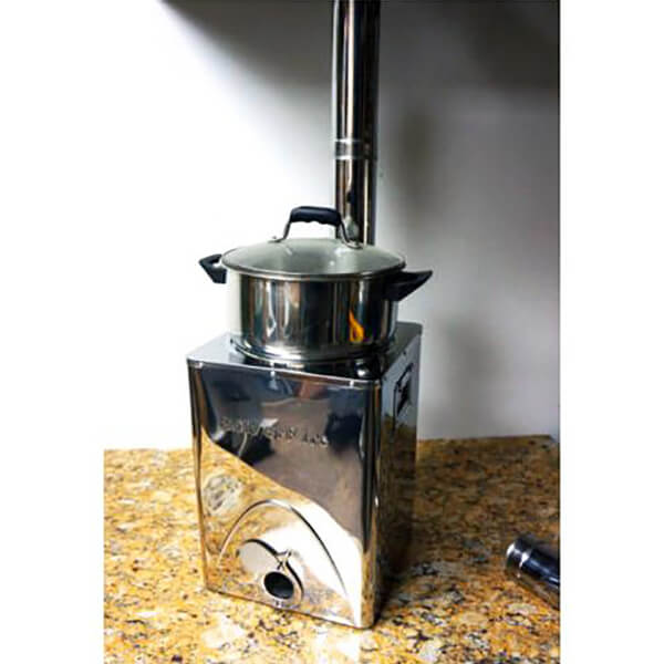 Stainless steel portable stove with pot on a countertop